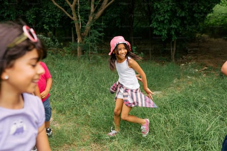 Outside, grass, playing, running, laughing, happy, friends, diverse, girls, children, siblings